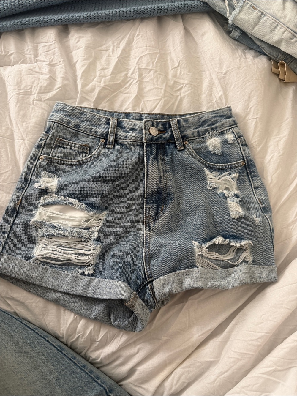 SHEIN Distressed Rolled-Hem Jean Shorts in Light Blue